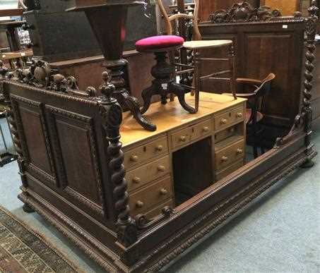 Lot 1326 - A Flemish oak three-quarter bed with carved...