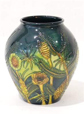 Lot 42 - A Modern Moorcroft Amazon Twilight Pattern 4/8 Vase, designed by Nicola Slaney, on a dark green...