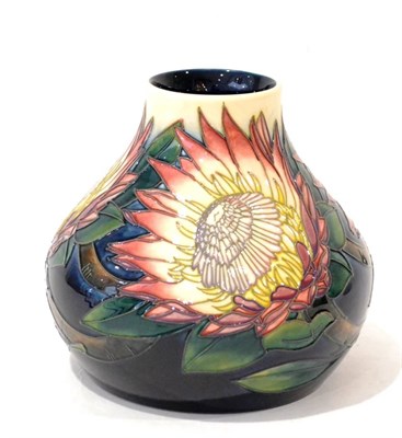 Lot 54 - A Modern Moorcroft King Protea Pattern Vase, designed by Angela Davenport, on a cream and blue...