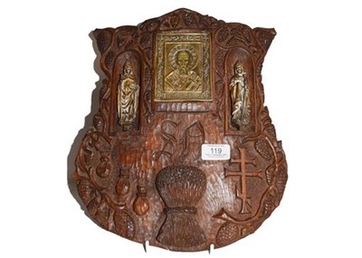 Lot 119 - Russian oak shield form icon with gilt metal...
