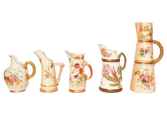 Lot 16 - Five Royal Worcester blush ware ewers painted...