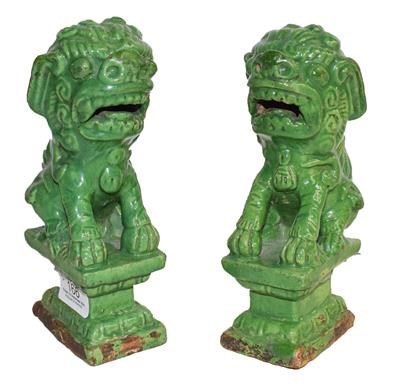 Lot 166 - A pair of green Fo dogs