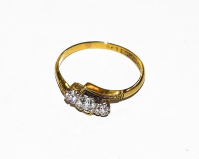 Lot 189 - A three stone diamond ring, stamped '18CT' and...