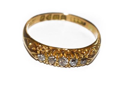 Lot 200 - An 18 carat gold diamond five stone ring, the...