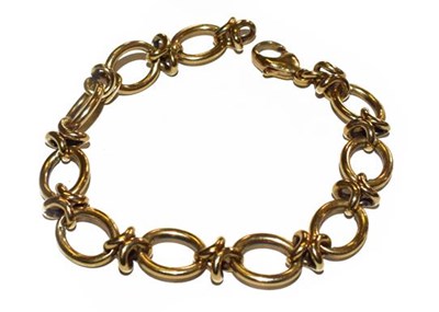 Lot 202 - A fancy link bracelet, clasp stamped '375',...
