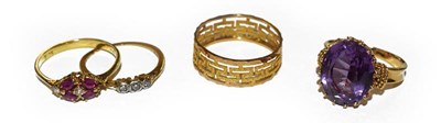 Lot 205 - A band ring, stamped '750', finger size O, a...
