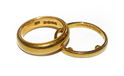 Lot 206 - Two 22 carat gold band rings, finger sizes K...