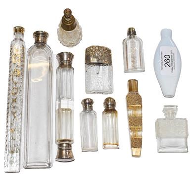 Lot 260 - A collection of glass scent bottles including...