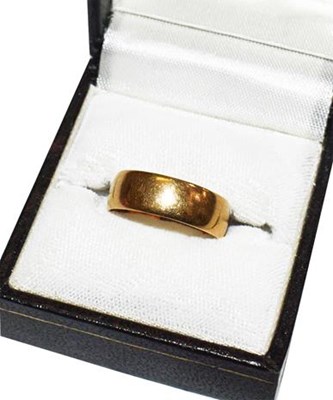 Lot 273 - An 18 carat gold band ring, finger size O