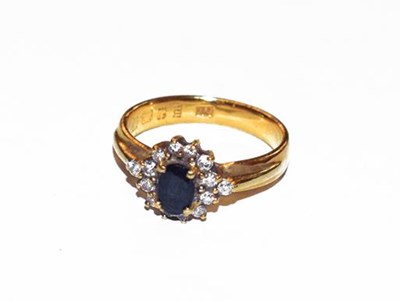 Lot 282 - A 22 carat gold sapphire and diamond cluster...