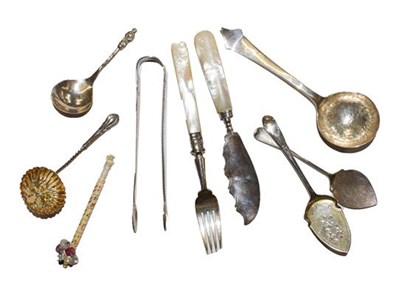 Lot 303 - A quantity of silver spoons and sugar tongs,...