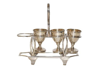 Lot 310 - A silver egg cruet (lacking one egg cup)