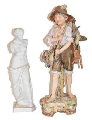 Lot 373 - A large Royal Dux figure of a boy carrying...