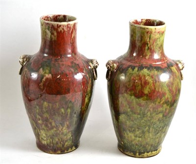 Lot 93 - A pair of red-green glazed baluster vases