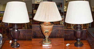 Lot 412 - Three lamps including a Toleware style fruit...