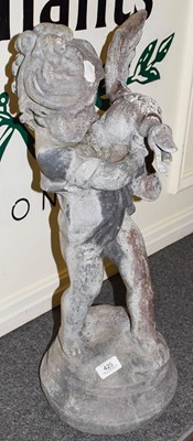 Lot 425 - A lead garden statue of a child and duck...