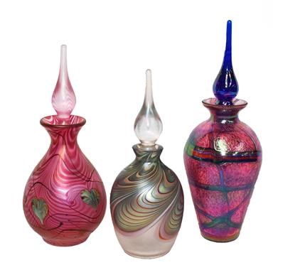Lot 5 - Okra glass comprising three iridescent scent...