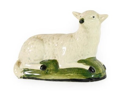 Lot 137 - A Creamware Model of a Sheep, circa 1800,...