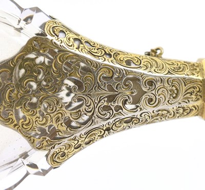 Lot 18 - A Silver-Gilt Mounted Clear Glass Scent-Bottle,...