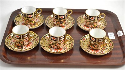 Lot 116 - A set of six Royal Crown Derby coffee cups and saucers