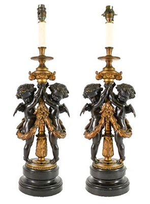 Lot 303 - A Pair of Gilt and Patinated Bronze Figural...