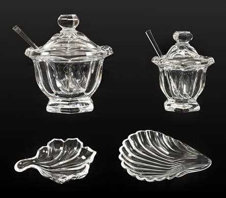 Lot 63 - A Set of Four Baccarat Glass Shell Dishes,...