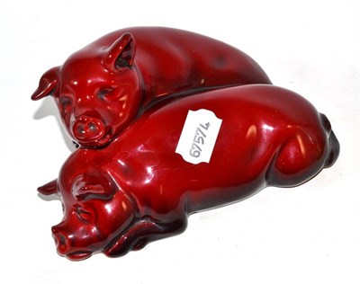 Lot 136 - Doulton flambe pigs signed Noke