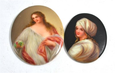 Lot 143 - An oval porcelain plaque of a lady, signed and another of a lady in a turban