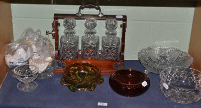 Lot 153 - A three bottle tantalus, two glass bowls and two Murano style coloured glass bowls