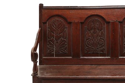 Lot 765 - A Joined Oak Settle, the back support with...