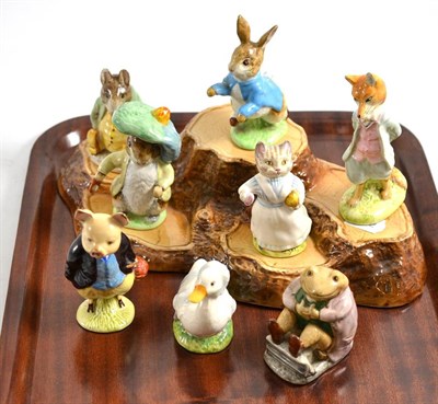 Lot 164 - Eight Beatrix Pottery figures (some damaged) and a stand