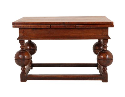 Lot 841 - A 17th Century Style Oak Drawleaf Dining Table,...