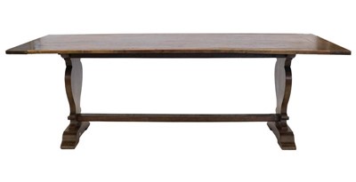Lot 862 - An Oak Dining Table, the plank top on trestle...