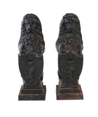Lot 872 - A Pair of Black Painted Cast Iron Heraldic...