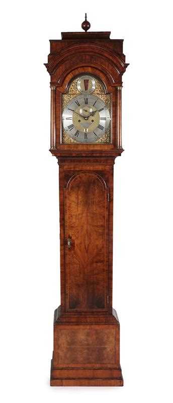 Lot 565 - A Walnut Eight Day Longcase Clock, case with...