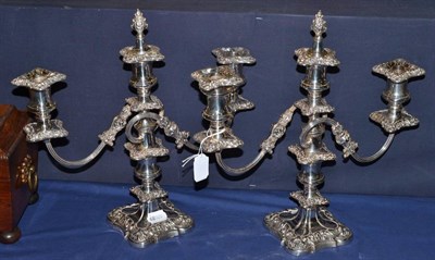 Lot 196 - A pair of silver plated three branch candelabra