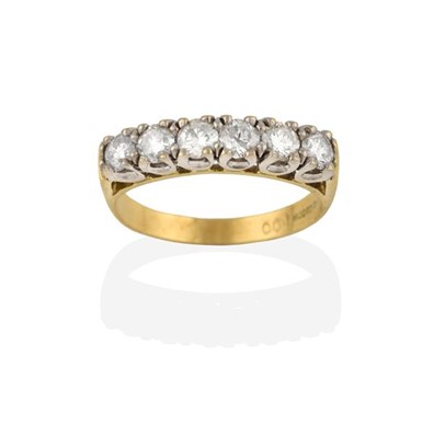 Lot 2261 - An 18 Carat Gold Diamond Six Stone Ring, the...