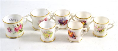 Lot 209 - Three Royal Worcester miniature loving cups and four Royal Worcester miniature cups (7)