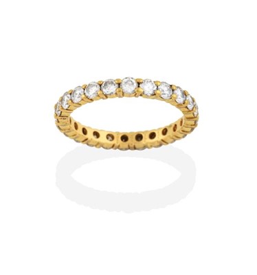Lot 2272 - A Diamond Eternity Ring, by Cartier, the round...