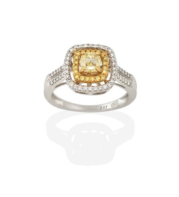 Lot 2277 - A Diamond Cluster Ring, the cushion cut yellow...
