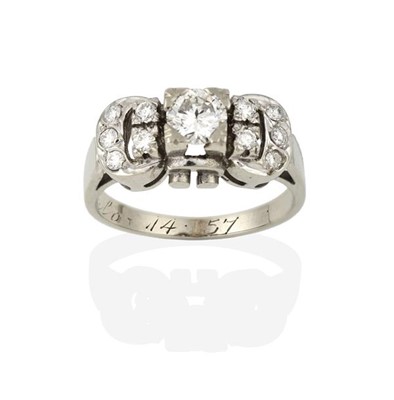 Lot 2291 - A Diamond Cluster Ring, the buckle motif set...
