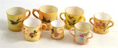 Lot 212 - Five Royal Worcester blush ivory miniature tygs and two Royal Worcester blush ivory mugs...