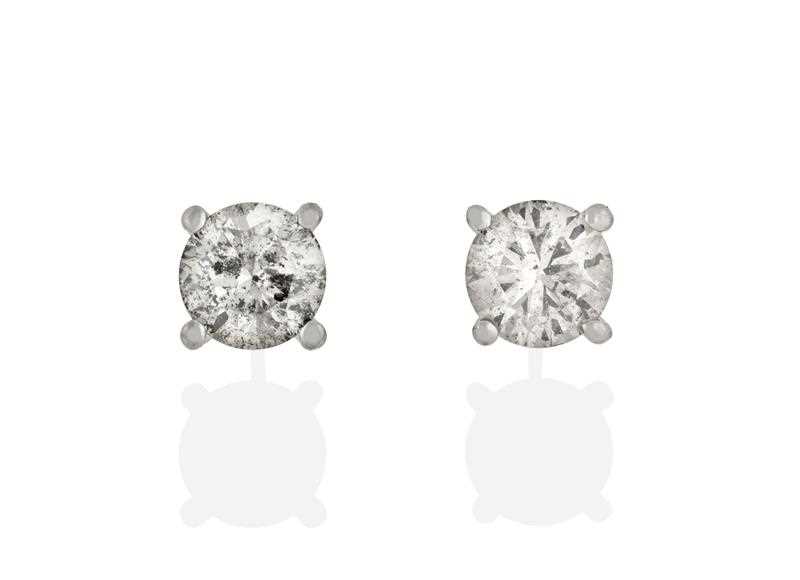Lot 2329 - A Pair of Diamond Solitaire Earrings, the...