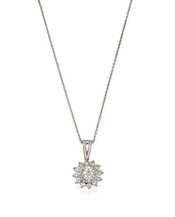 Lot 2354 - A Diamond Cluster Pendant on Chain, a round...