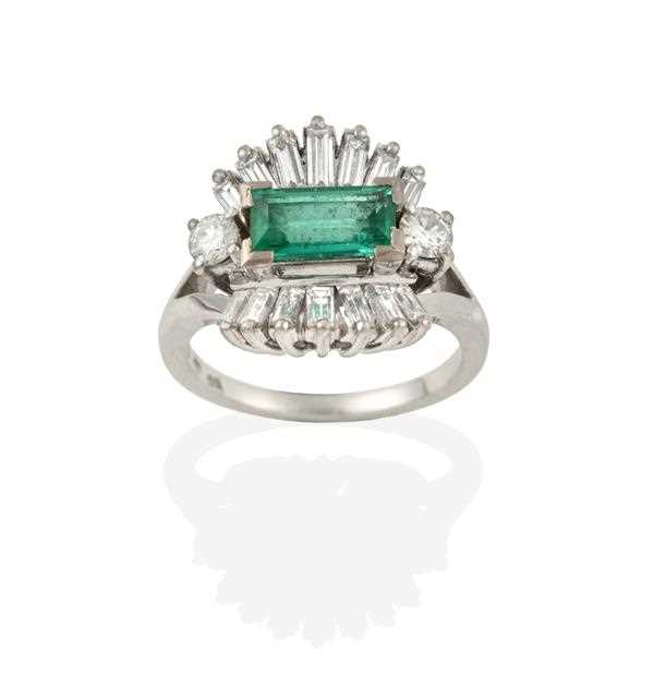 Lot 2357 - An Emerald and Diamond Cluster Ring, the...