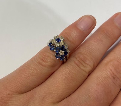 Lot 2359 - A Sapphire and Diamond Cluster Ring,...