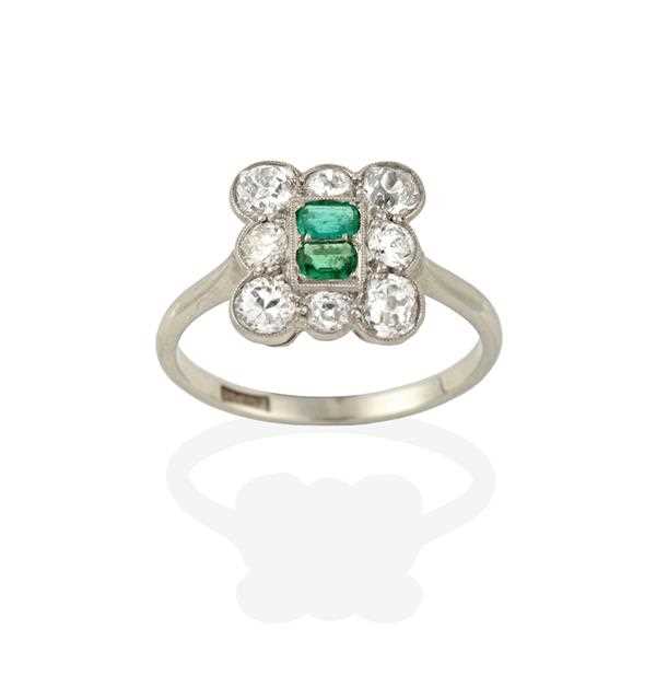 Lot 2360 - An Emerald and Diamond Cluster Ring, two...