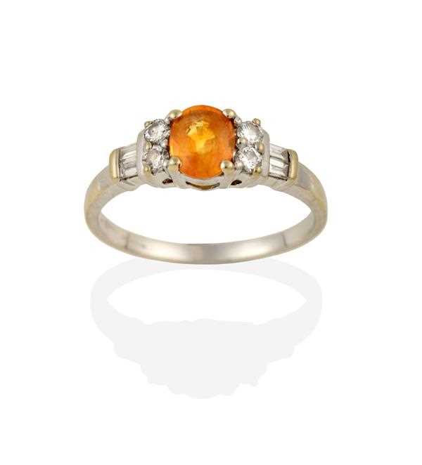 Lot 2363 - A Yellow/Orange Sapphire and Diamond Ring, the...