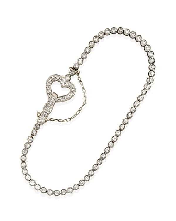Lot 2366 - A Diamond Line Bracelet, the round brilliant...