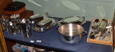 Lot 238 - A quantity of silver plate, tureens and covers, three piece tea set, cake server, crumb scoop etc